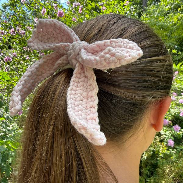 The bow clipped into a ponytail